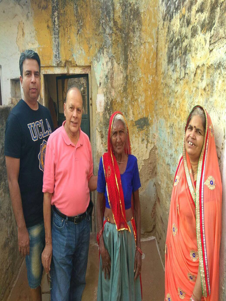 Dr. Shandilya Providing Financial aid to Poor Widows